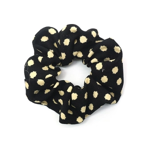French vintage black scrunchie with beige polka dots and textured knit fabric pattern
