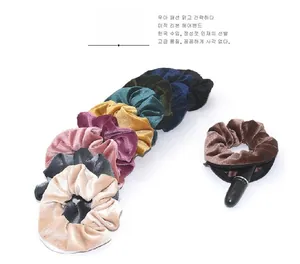 Detail showing the hidden zipper pocket on soft velvet scrunchies for small storage