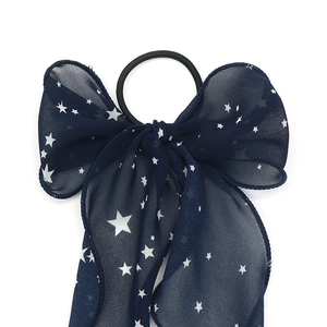 Navy blue chiffon bow scrunchie with white star patterns and long streamers