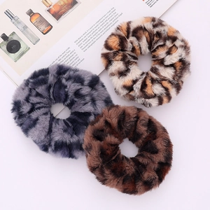 Three-piece leopard print plush scrunchies in gray blue, golden brown and dark coffee