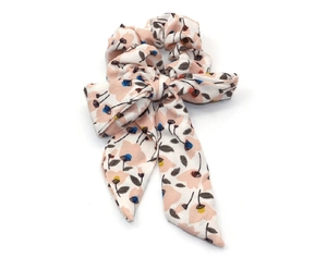 Detail of floral scrunchie with ribbons showing the striped fabric texture and patterns