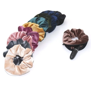 Velvet scrunchies with hidden zipper pocket for small items shown in various colors