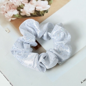 Sparkly light blue scrunchie with glitter fabric texture for stylish hair styling