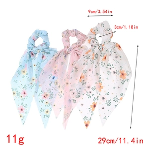 Floral chiffon hair scrunchies with long streamers showing dimensions of 29cm length