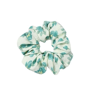 Floral print scrunchie in green and yellow crepe fabric for ponytail hairstyles