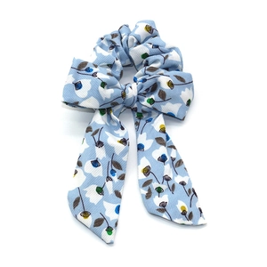 Floral print bow scrunchie with long ribbons in light blue fabric for hair styling