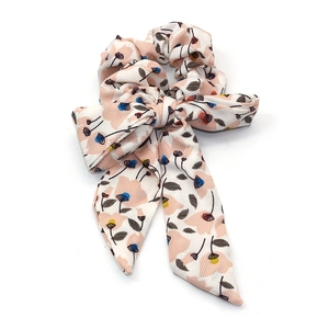 Floral print scrunchie with long bowknot tails in light beige on white background