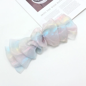 Iridescent oversized chiffon bow hair clip with colorful rainbow laser fabric effects