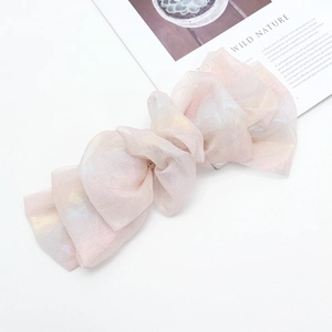 Iridescent chiffon oversized bow hair clip with colorful rainbow shimmer effect