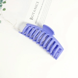 Detail of a 14cm purple matte finish hair claw clip with large double-row teeth design
