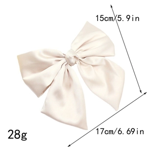 Detail showing dimensions 17x15cm and 28g weight of a large champagne satin bow hair clip