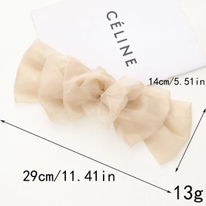 Détail du grand nœud papillon en dentelle beige avec dimensions et spécifications