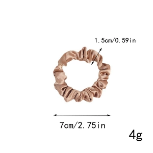 Detailed size view of a light brown satin scrunchie with 7cm diameter and 1.5cm width specs