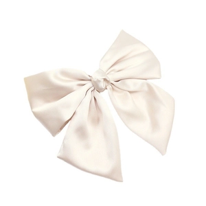 Elegant large cream satin bow hair clip with a smooth glossy finish on white background