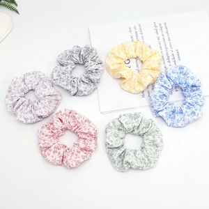 Floral print hair scrunchies set in six pastel colors on white background