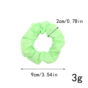 Détails des dimensions du chouchou vert fluo : diamètre de 9cm et poids léger de 3g