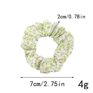 Floral print scrunchie showing detailed dimensions including 7cm diameter and 4g weight