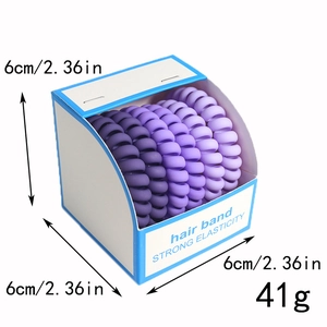Three gradient purple spiral hair bands in a white box with size and weight details