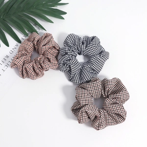 Retro houndstooth pattern hair scrunchies set in black and brown fabric textures