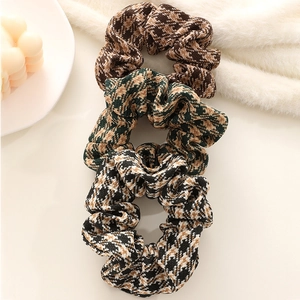 Set of three retro houndstooth pattern hair scrunchies in wool knit fabric