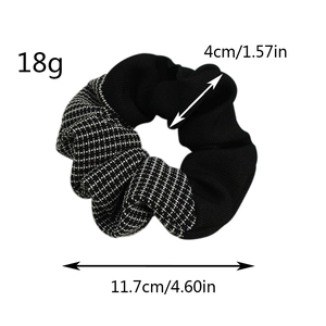 Detail showing dimensions of black ribbed and checkered scrunchie with 18g weight info