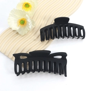 Pair of large matte black shark hair claws with non-slip finish for thick hair styling
