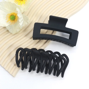 Matte black oversized shark hair clips in geometric rectangle and wavy braided designs