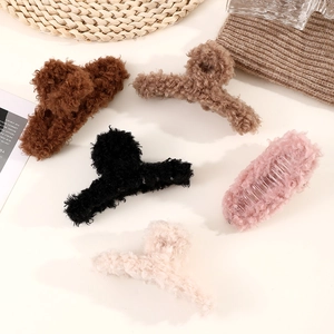 Plush lamb wool hair claw clips set in five neutral colors for elegant winter styling