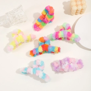 Close-up of soft colorful plush hair claw clips set in various rainbow macaron colors