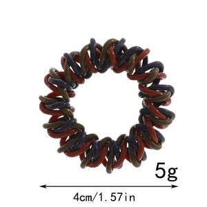 Macro shot showing 4cm diameter and 5g weight of tricolor spiral telephone hair ties