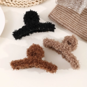 Three plush faux fur hair claws in black, brown, and khaki for autumn winter hairstyles