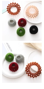 Macro shot of bird nest hair rings in six colors with soft flocking velvet texture