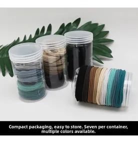 Detail of 7 seamless hair ties in a clear storage jar with multi-color options