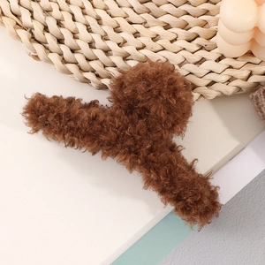 Close-up of soft brown faux fur hair claw clip with plush texture and sturdy grip