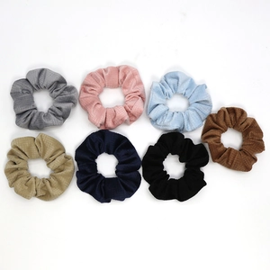 7-piece set of velvet ribbed scrunchies in multiple vintage colors for elegant hairstyling