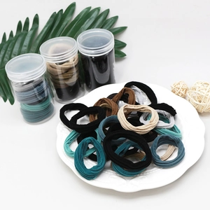 Elastic seamless hair ties set in clear jars with neutral colors and soft texture
