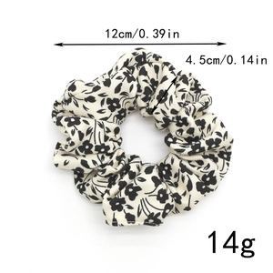 Detail showing dimensions of black and white floral scrunchie with 12cm outer diameter