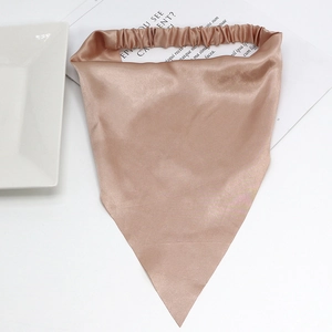 Detailed view of champagne satin headscarf with elastic band on white background
