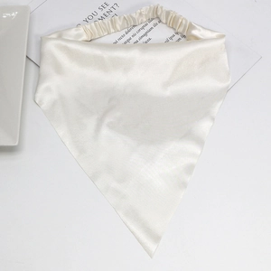 Detailed macro view of champagne white satin headscarf texture with elastic band