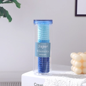 Lot d'élastiques à cheveux dégradé bleu dans un pot avec haute élasticité et texture