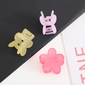 Matte floral hair claw clips in yellow pink and lavender for ponytail styling