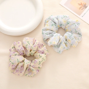 Two-piece floral chiffon scrunchie set in cream and light blue colors for elegant hair styling