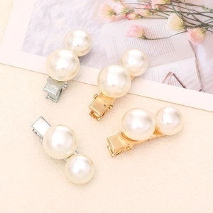Set of four elegant pearl hair clips with gold and silver duckbill metal bases