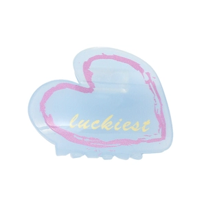 Pince à cheveux cœur en acétate bleu clair avec motif cœur rose et texte luckiest