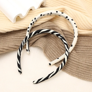 Set of two zebra print and polka dot sponge headbands in a minimalist retro fabric style