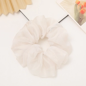 Elegant white organza scrunchie with pleated design on a clean minimalist background