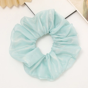 Pale blue pleated organza scrunchie with metallic sheen for elegant hair styling