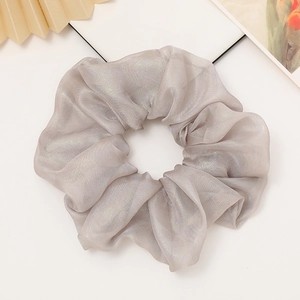 Elegant champagne grey organza scrunchie with metallic shimmer for hair styling