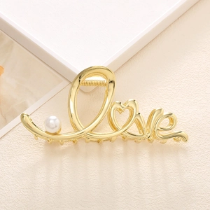 Elegant gold metal Love hair claw clip with heart shape and pearl accent for women