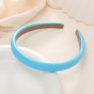 Detail of light blue faux leather padded headband with non-slip brown velvet lining